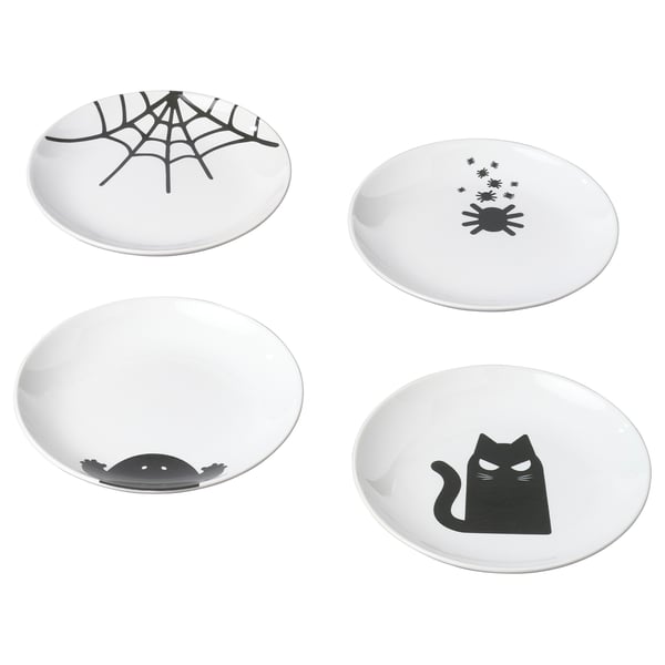 Four white KUSTFYR plates, each with black halloween-themed designs in different positions. Made of stoneware.