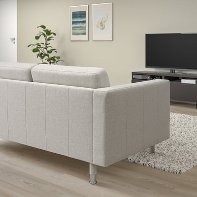 Beige LANDSKRONA sofa with chrome legs in modern living room.