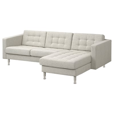 This image shows a light grey, modern sectional sofa with tufted cushions and chrome legs. Its designed for comfort and style.