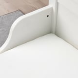A fitted white sheet shown on a mattress, secured by elastic edges.