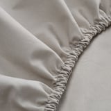 Elastic edge fitted sheet, crafted from soft cotton and lyocell blend, ensuring secure and comfortable sleeping.