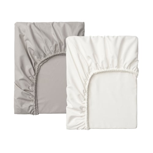 Two fitted sheets displayed, one grey, one white, elastic edges for secure fit.