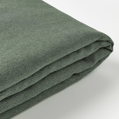Close-up of a green fabric, folded smoothly, showcasing its soft texture and subtle pattern.