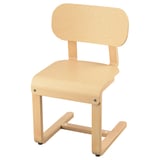 LYCKAN light wood cantilever chair with curved back and seat.