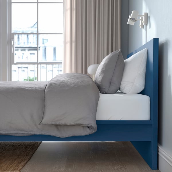 MALM blue bed, high headboard, grey linens, modern. Large, fits room well.