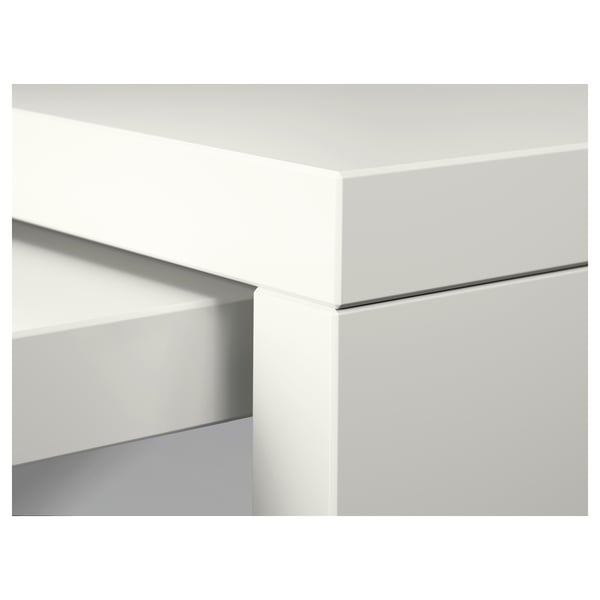 Modern, white furniture detail with sleek lines and smooth surfaces.