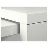 Modern, white furniture detail with sleek lines and smooth surfaces.