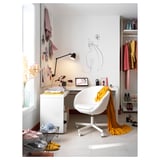Minimalist home office with white desk, chair, and closet. Decor includes wall art, lamp, and clothes rack.