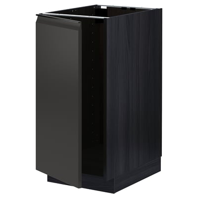 A black METOD kitchen cabinet with a sleek, modern design featuring a matte black finish. It has a rectangular shape and includes a pull-out handle.