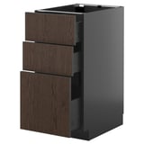 Modern kitchen unit, black with dark wood drawers, sleek design.