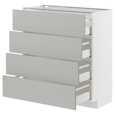 Modern white METOD kitchen cabinet with four grey drawers, square shape, clean design.