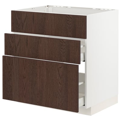 An ikea METOD kitchen unit with three dark brown sinarp drawers featuring solid wood edging on a white frame.