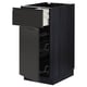 Modern black kitchen cabinet with drawer and shelves, sleek design, part of METOD system.