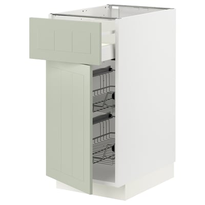 An open green ikea METOD kitchen cabinet with multiple storage shelves.