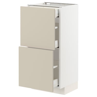 Beige METOD kitchen unit with two drawers and a cabinet. Modern minimalist design. White frame, smooth edges.
