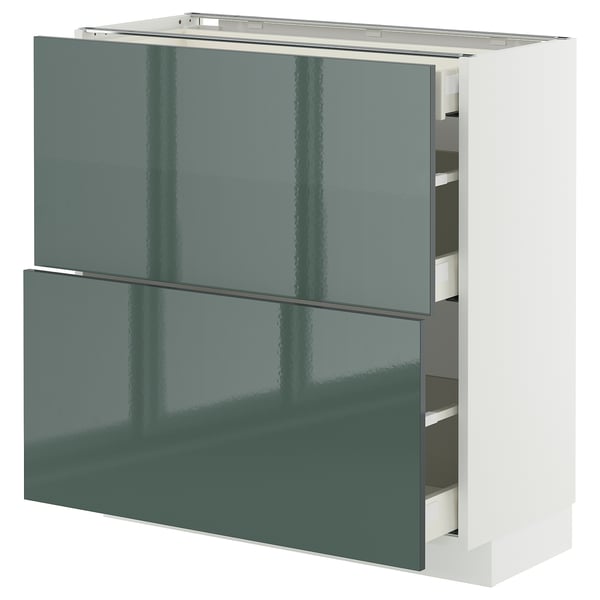 High-gloss green-grey METOD kitchen cabinet with four white drawers, sleek and modern design.