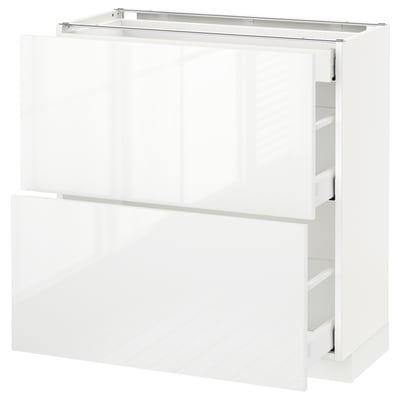 White METOD kitchen cabinet with high gloss finish and multiple drawers.