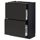 Black METOD kitchen unit with sleek, dark handles and two open drawers exposing white interior compartments, framed by a modern design.