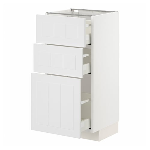 White METOD kitchen cabinet with multiple drawers and doors, modern design.