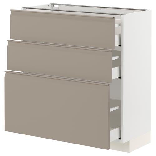 Modern kitchen cabinet with three smooth, beige drawers featuring integrated handles, set against a white background.