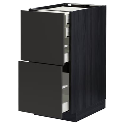 Modern black kitchen cabinet with open drawers, dark wood grain.