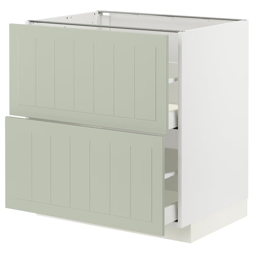 A METOD kitchen unit in green with drawers, sleek edges, and an open drawer on the bottom right.