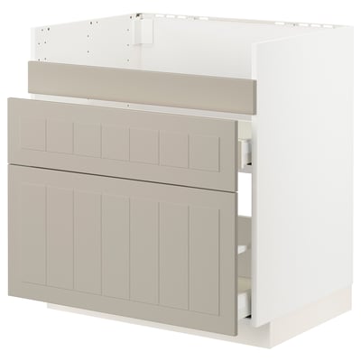 An ikea METOD kitchen cabinet in beige with beige panel design and metal runners.