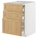 A white METOD kitchen cabinet with three light oak drawers and a pull-out work surface.
