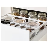 White kitchen drawer with jars and containers, showcasing adjustable storage and smooth sliding mechanism.