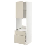 A white METOD kitchen unit with beige drawers and a cabinet, featuring adjustable shelves and smooth-closing drawers.
