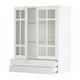 A white METOD kitchen cabinet with glass doors and drawers. It a modern, minimalist design with sleek lines and glass inserts.