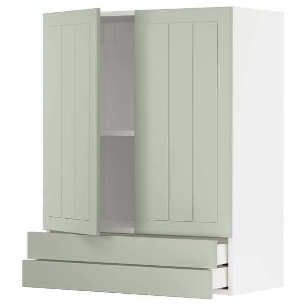 A green METOD kitchen cabinet with drawers and adjustable shelves.