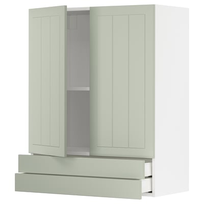 A green METOD kitchen cabinet with drawers and adjustable shelves.