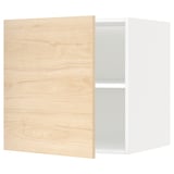 A white ikea METOD kitchen wall cabinet with a light ash wood-patterned door. Its rectangular, featuring an adjustable shelf inside.