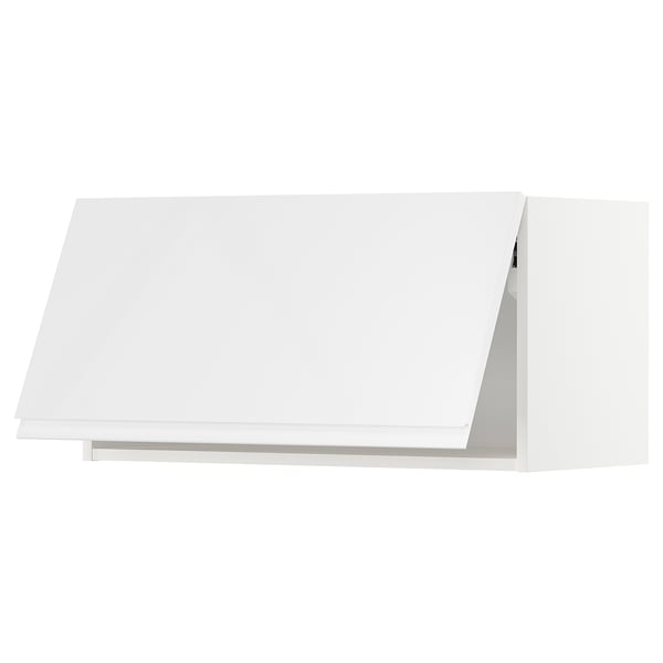 A white, modern kitchen cabinet from the METOD system, featuring high gloss and sleek, minimalist design.