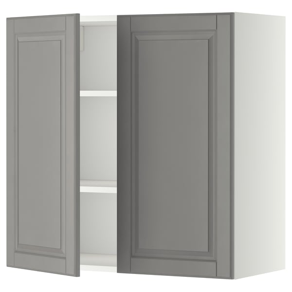 Modern grey kitchen cabinet with one open door, rectangular shape, and beveled edges.