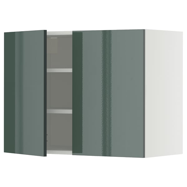 Greenish high-gloss kitchen cabinet with adjustable shelves, modern design.