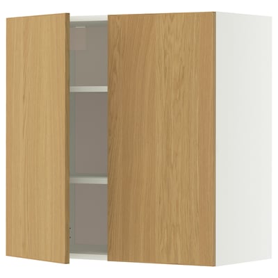 A light wood-colored wall cabinet with a single open door. The cabinet sleek, modern lines and adjustable shelves.