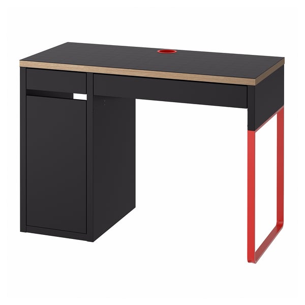 Modern black and red desk with storage, featuring cable management and adjustable shelves.