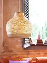 A hanging bamboo lamp, white, round, geometric pattern, soft glow, natural touch.