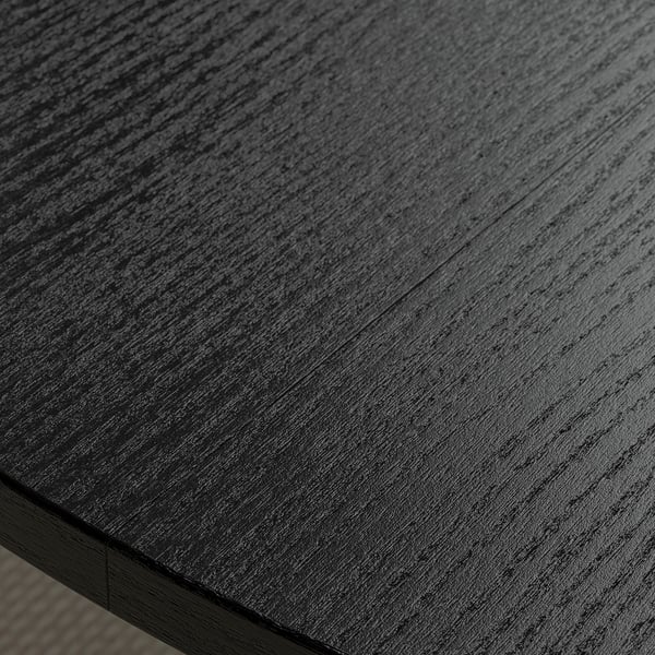 Dark wood conference table with smooth, polished surface.