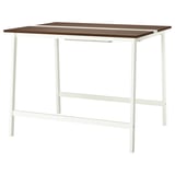 Modern high conference table with brown top, white legs, for sitting/standing with footrest.
