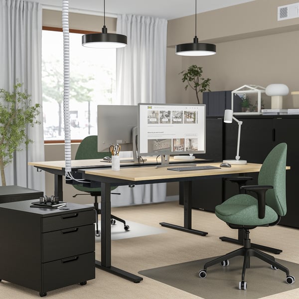 Modern office setup: MITTZON desks, dual monitors, green chairs, sleek design, plants, pendant lights.