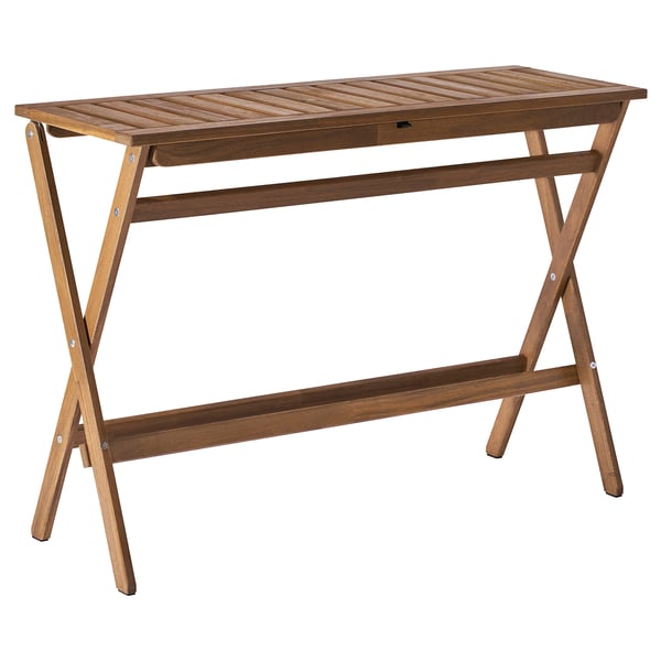 A brown NÄMMARÖ folding wooden outdoor table with a rectangular top and x-shaped legs.
