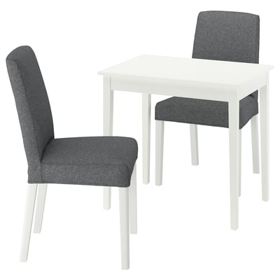 Small white dining set with gray chairs, modern design with upholstered seats.