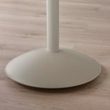 Modern chair base, sleek design. White metal finish, round base plate.