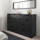 Minimalist bedroom: NORDLI black chest with 9 drawers, mirror above, lamp & decor on top. Fits under large window.