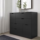 Modern black NORDLI chest with 6 drawers, by window, small plant on top.