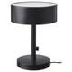 Option: A NYMÅNE table lamp, black, with a cylindrical shade and base, made of metal and glass, providing soft diffused light.