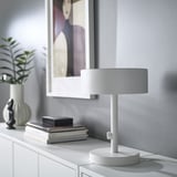 NYMÅNE lamp on shelf with books, plant, decor.
